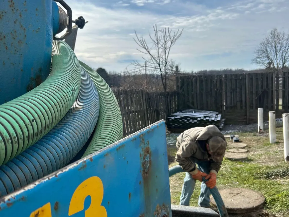 Wetherell septic pumping hose and tank on a job site in the Ohio Valley