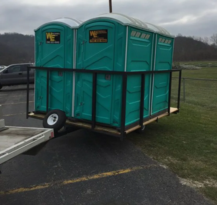 Portable toilets loaded on a Wetherell trailer for delivery